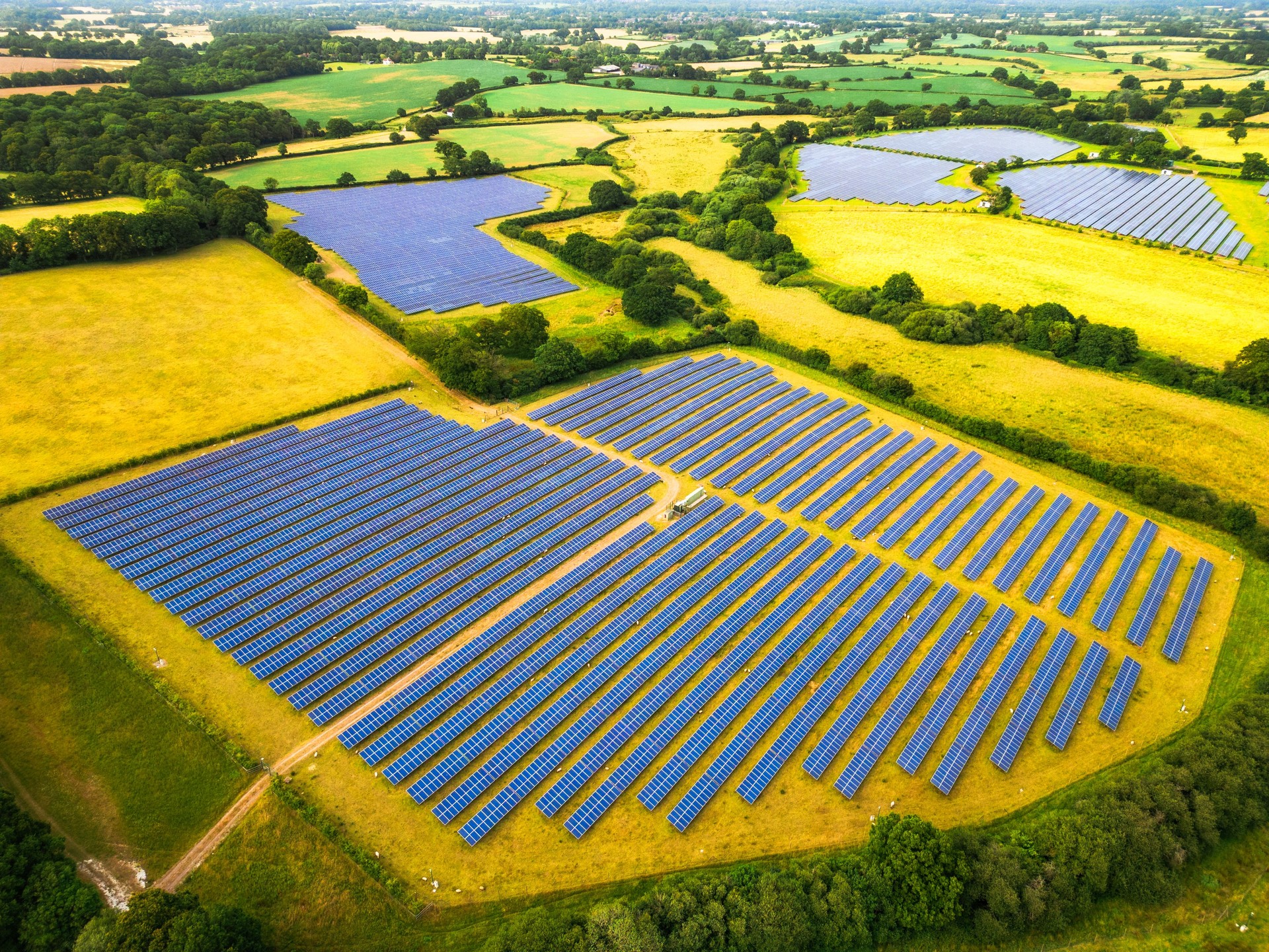 Aerial view of solar farm in rural landscape